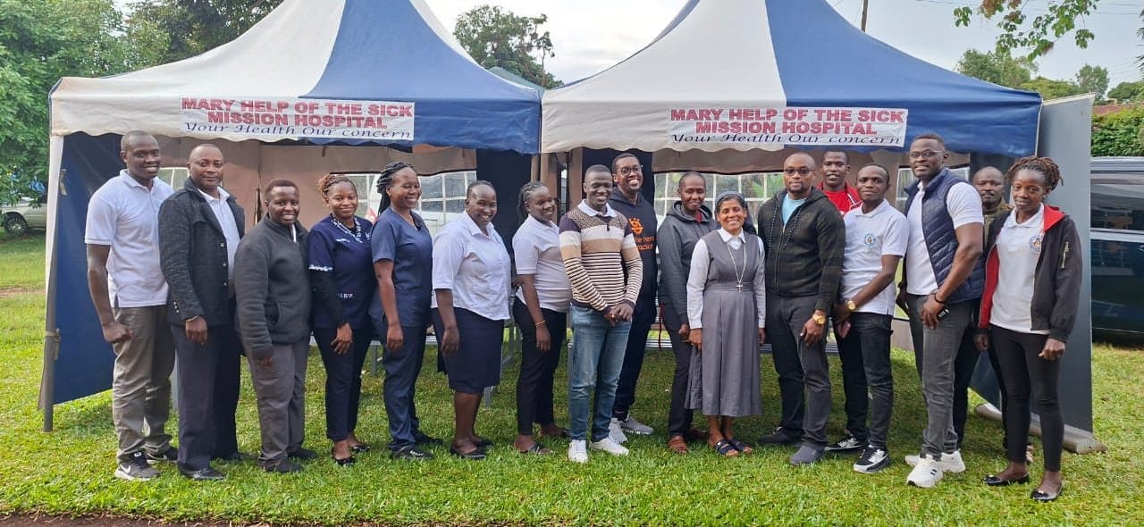 Doctors, nurses, Sisters and administrative staff of Mary Help of the Sick Mission Hospital gathered on the hospital grounds