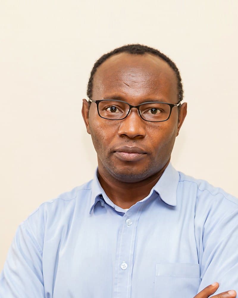Portrait of Dr. Jesse Gitaka, Chief Medical Officer