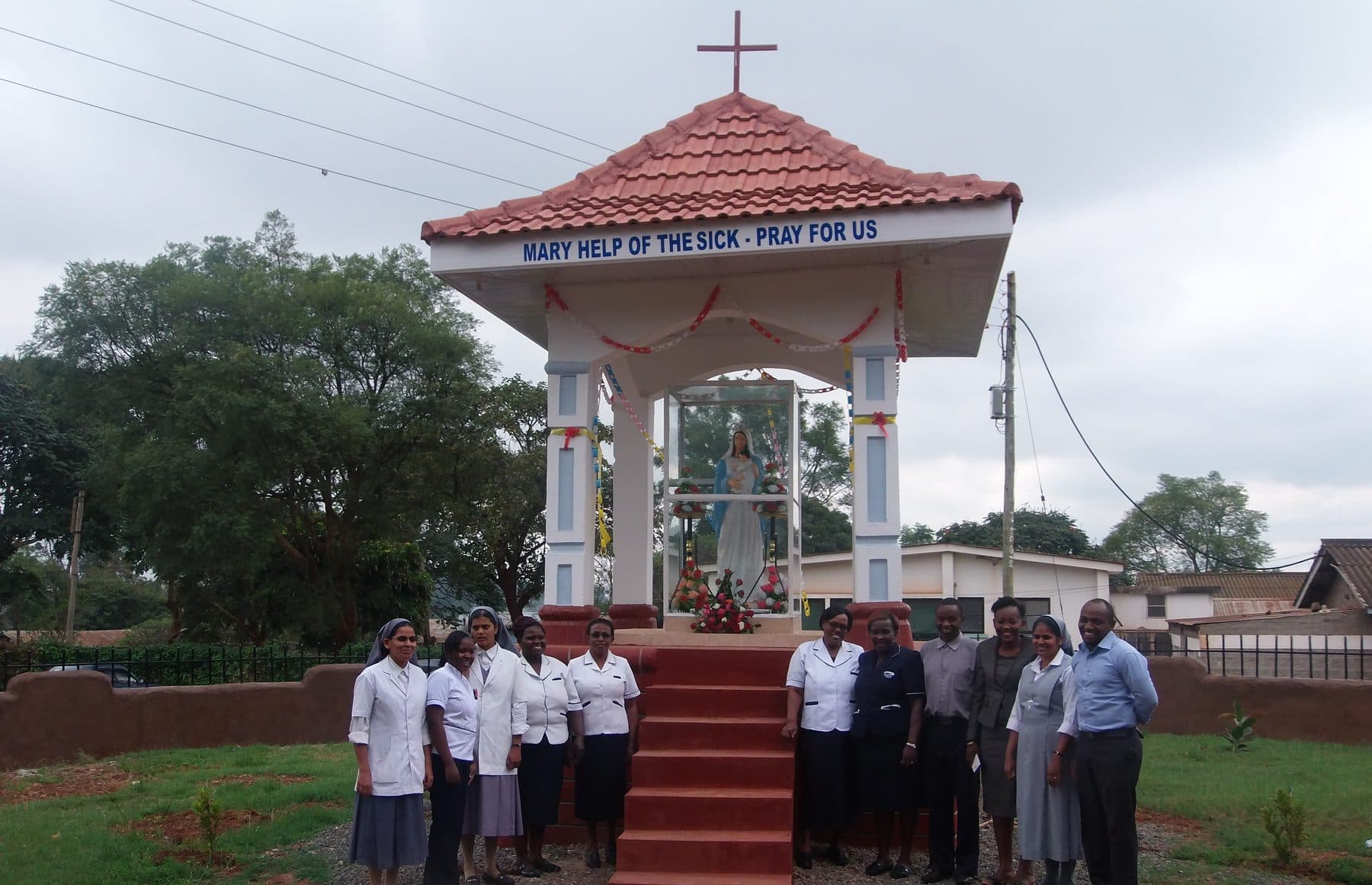 Sisters, nurses and staff gathered at the Marian grotto in the hospital grounds